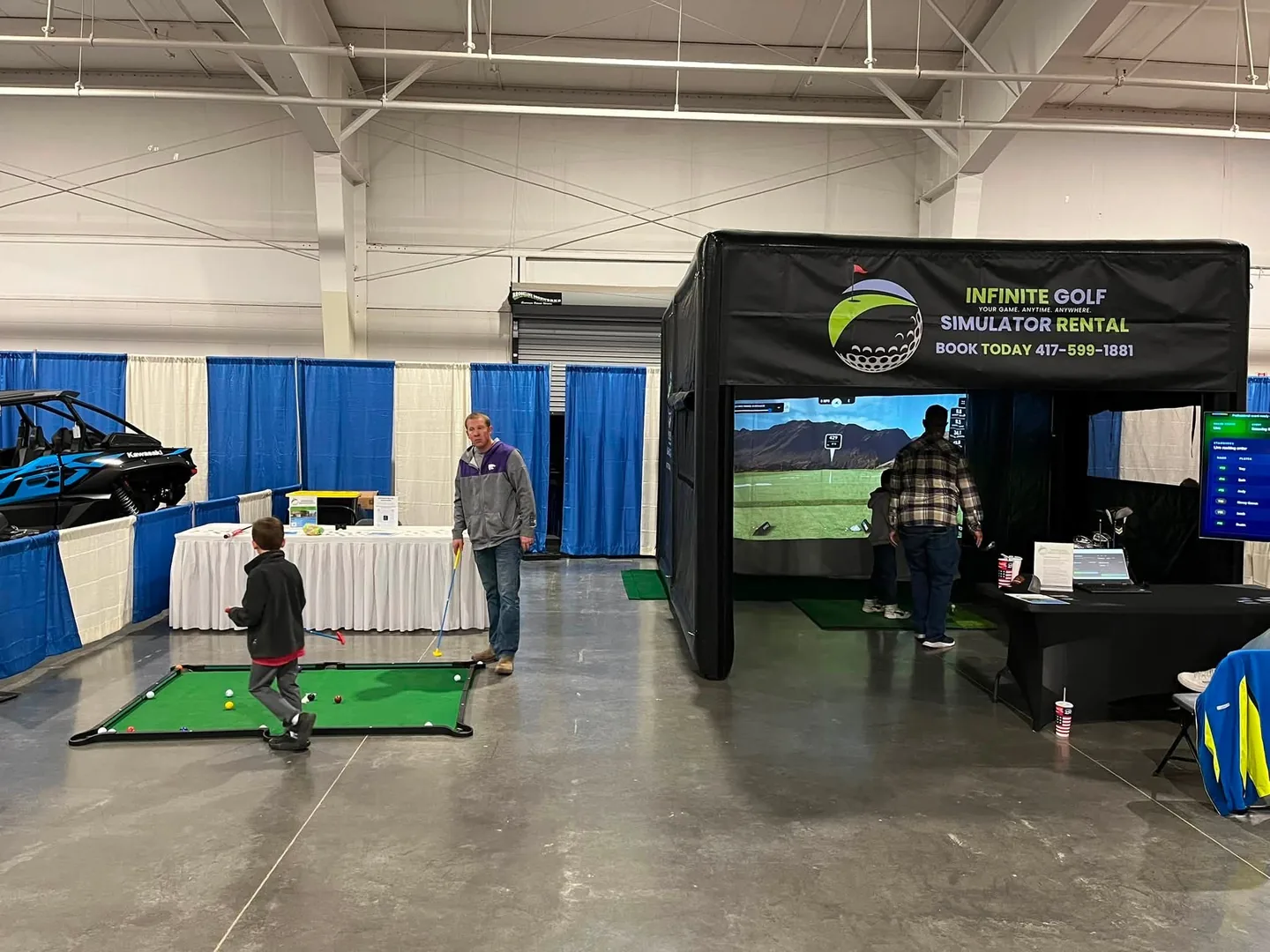 Infinite Golf simulator operating in the exhibition hall at the Ozark Empire Man Show Expo.