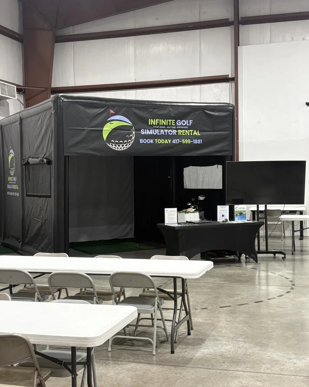 Authentic Infinite Golf enclosure and event setup before guests arrive at a Southwest Missouri fundraiser