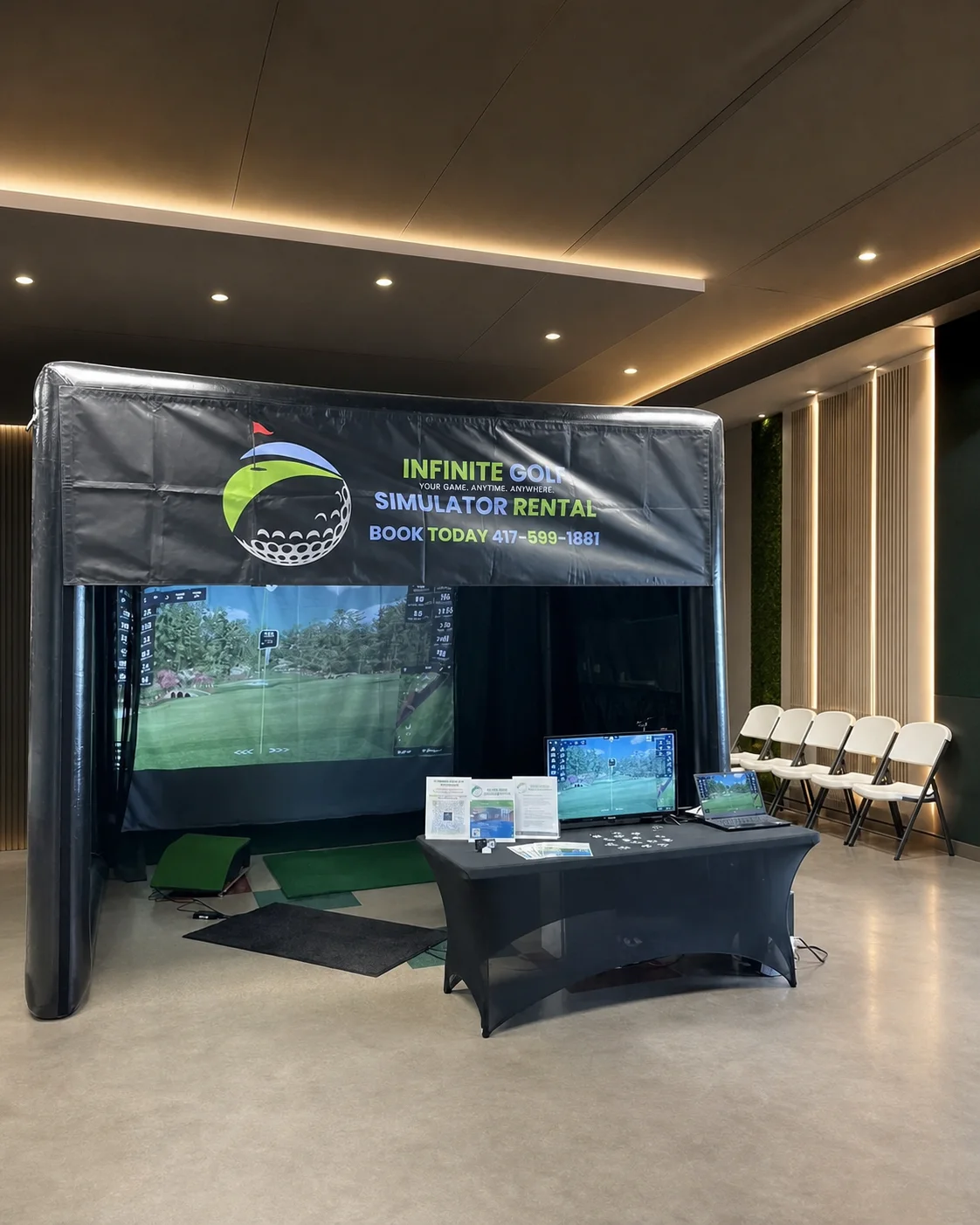 Representative Infinite Golf mobile simulator setup showing the branded enclosure, impact screen, hitting area, and operator station.